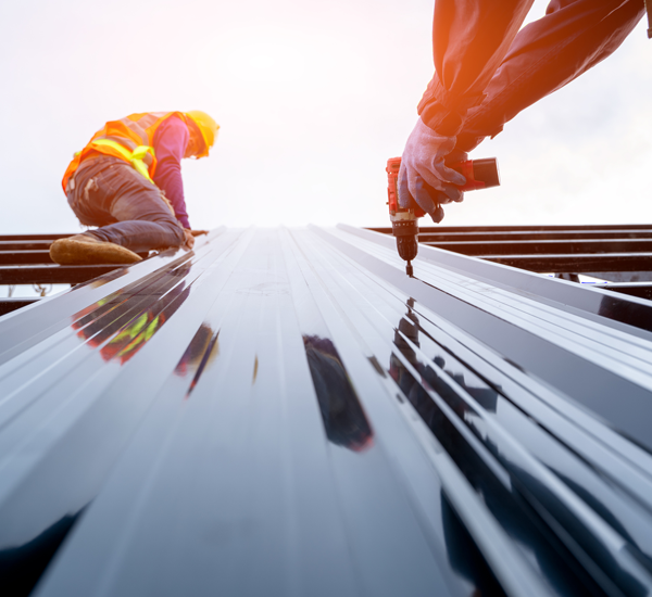 Two Workers Installing Commercial Metal Roof — Dyersburg, TN — Frazier Roofing